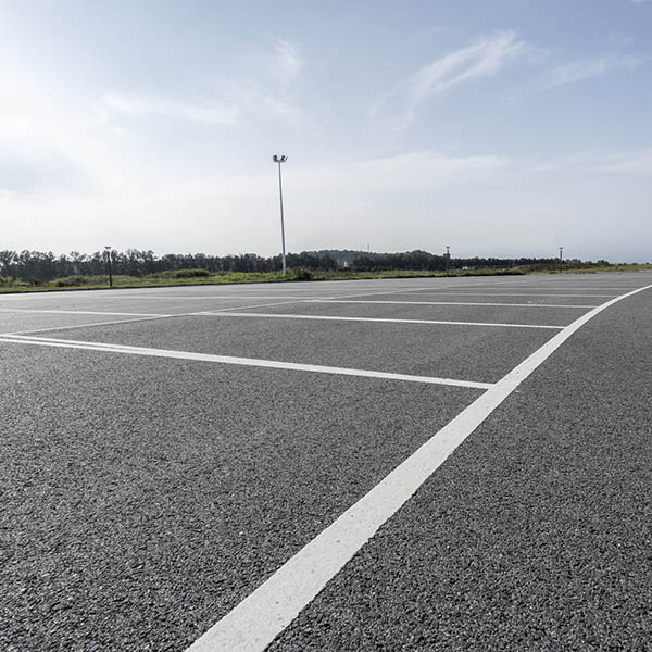A parking space on an empty asphalt road