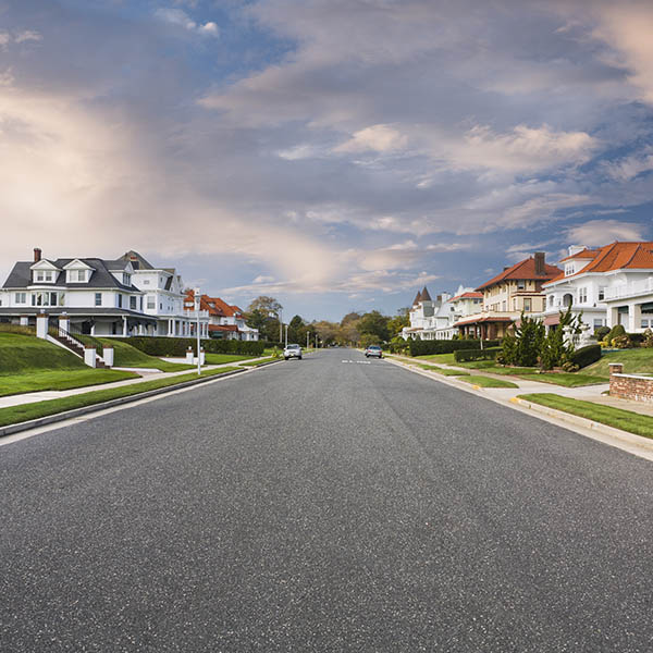 Empty road with nice residential homes in the community